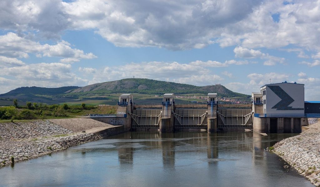 A reservoir and dam holding back blue water