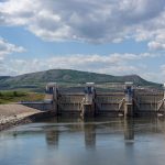 A reservoir and dam holding back blue water