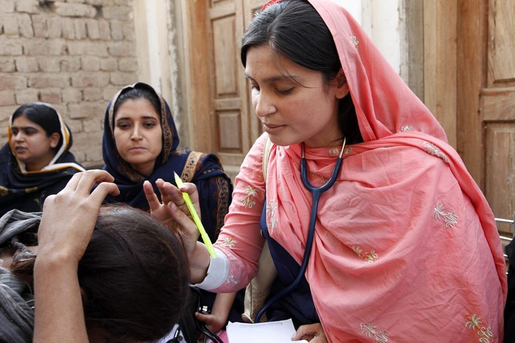 Doctor examining a woman patient