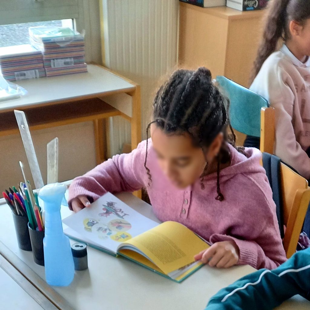 Students in a classroom studying without smartphones on their desks